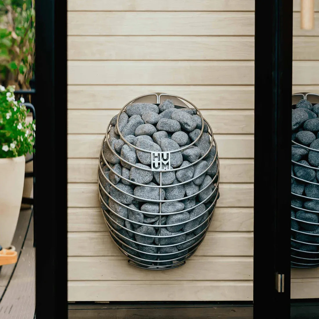 HUUM DROP electric sauna heater, steam water on stones.