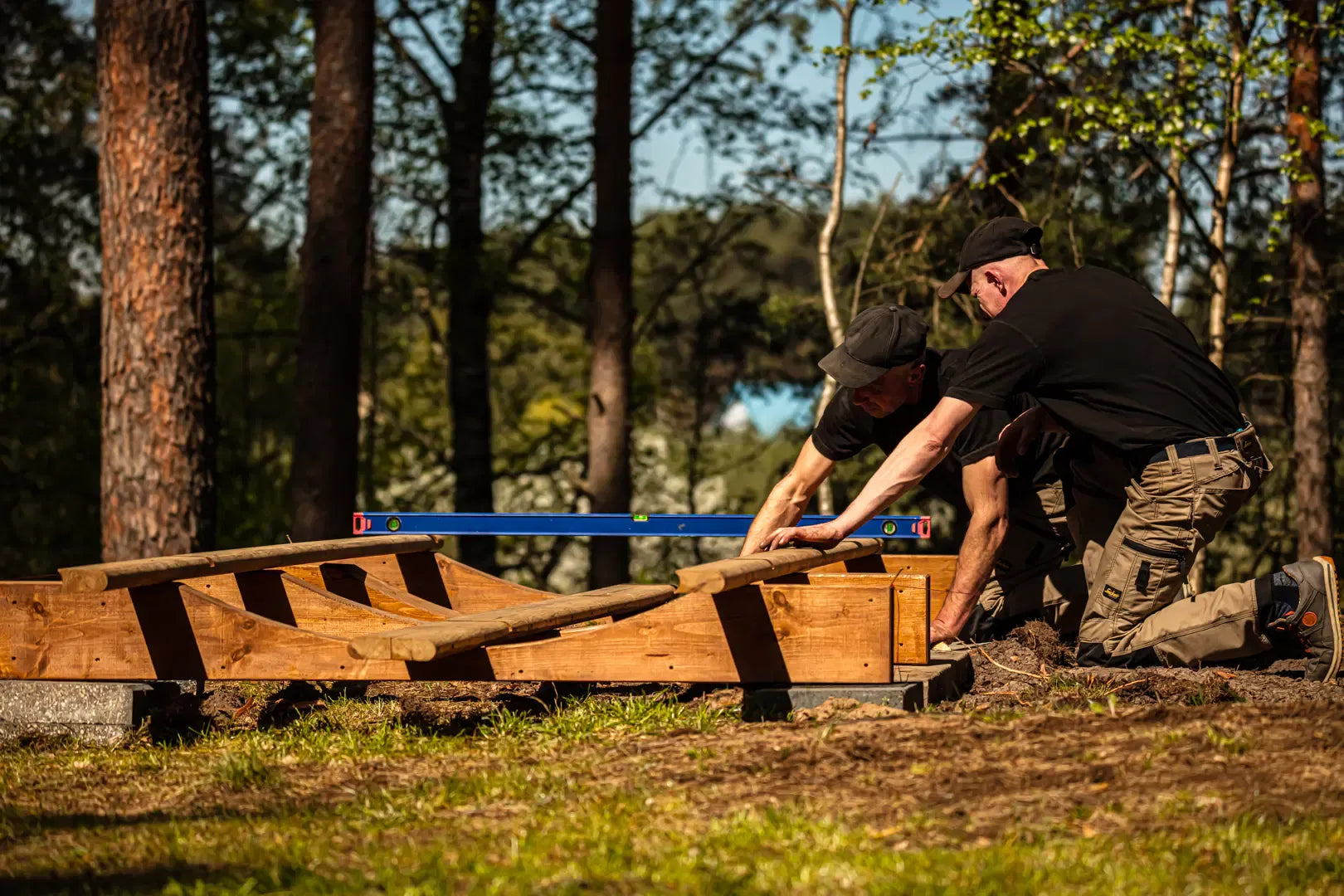 Assembly/install image showing the base supports for the Hekla Barrel Sauna 210.