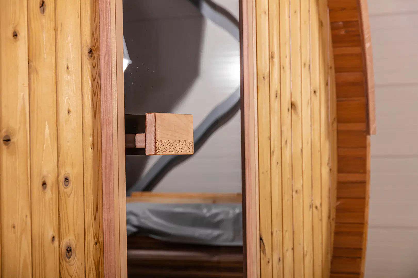 Close-up of the Hekla Barrel Sauna 250 door handle and latch.