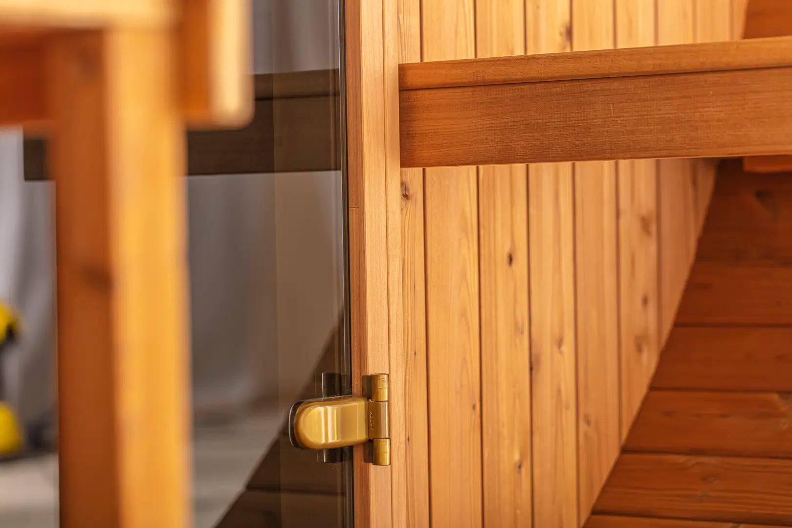 Close-up of the Hekla Barrel Sauna 250 door hinge detail.