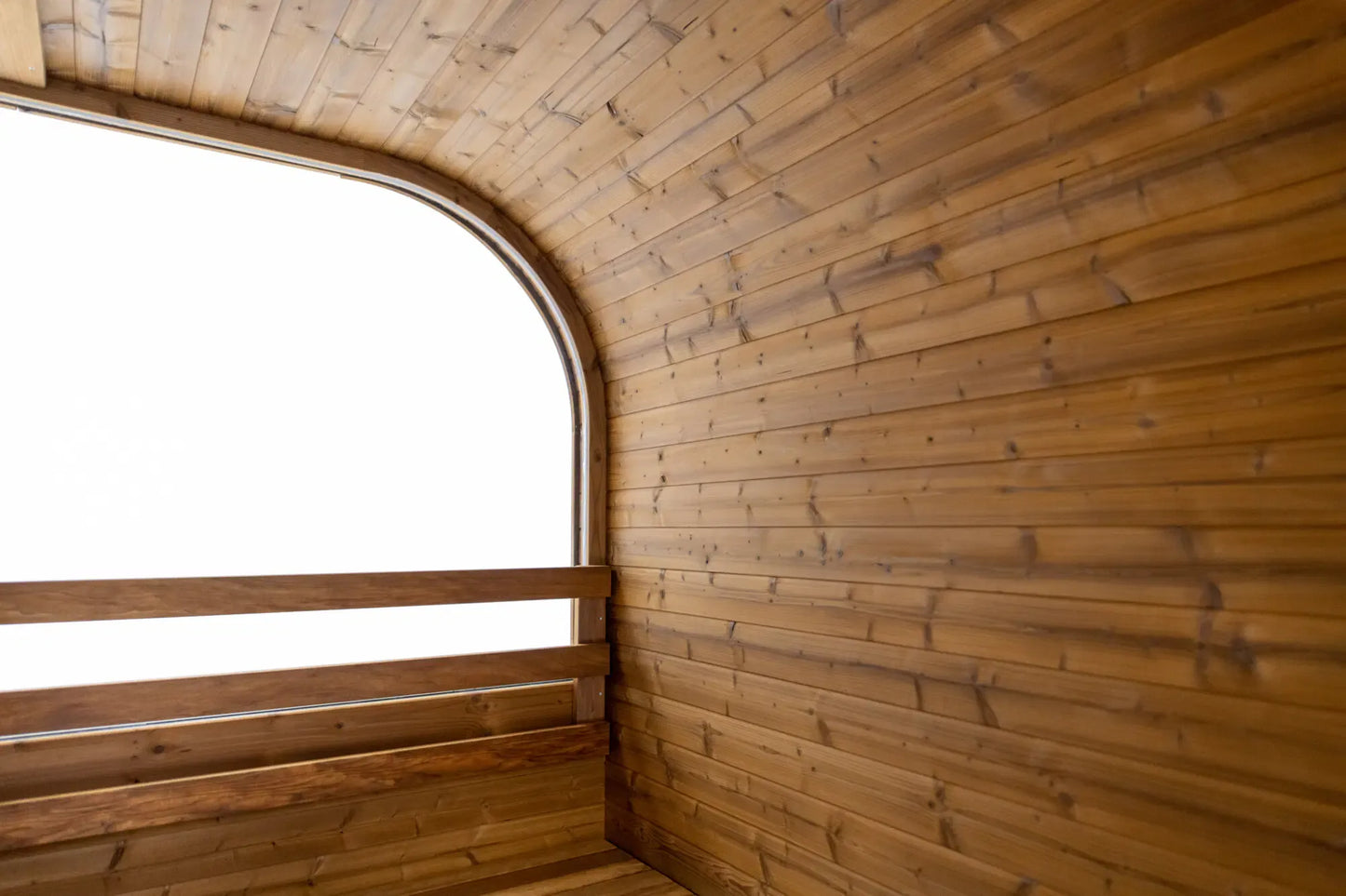 Hekla Cube Sauna 210 outdoor cube sauna, interior view to front glass.