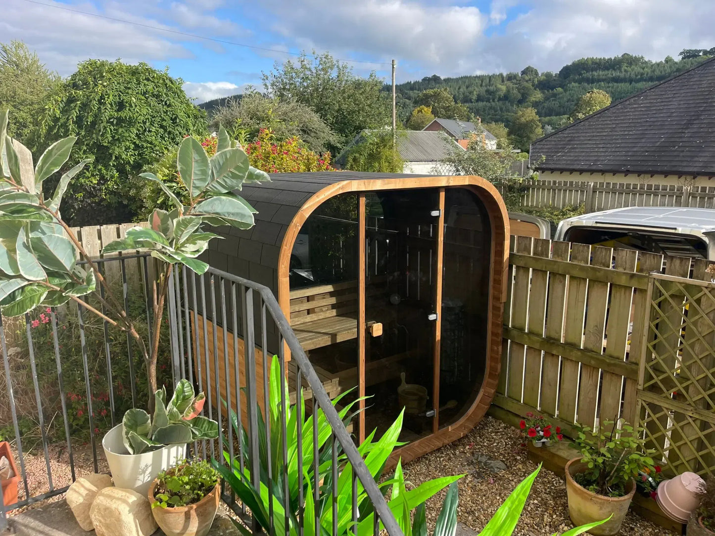 Hekla Cube Sauna 210 outdoor cube sauna, lifestyle garden deck installed.