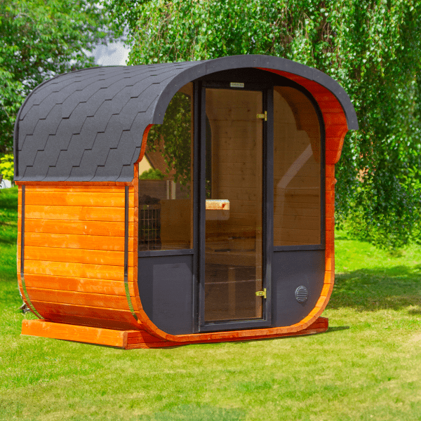 Hekla Cube Sauna 160 outdoor cube sauna, lifestyle garden front view.