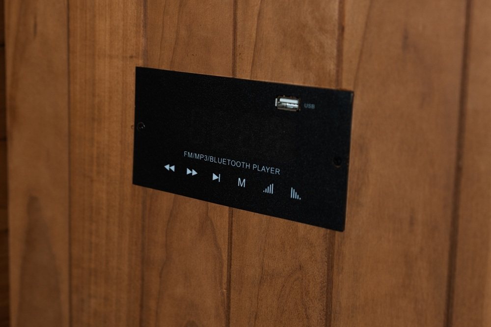 Bluetooth/MP3 audio player panel with USB port inside the Hekla IR100 sauna.