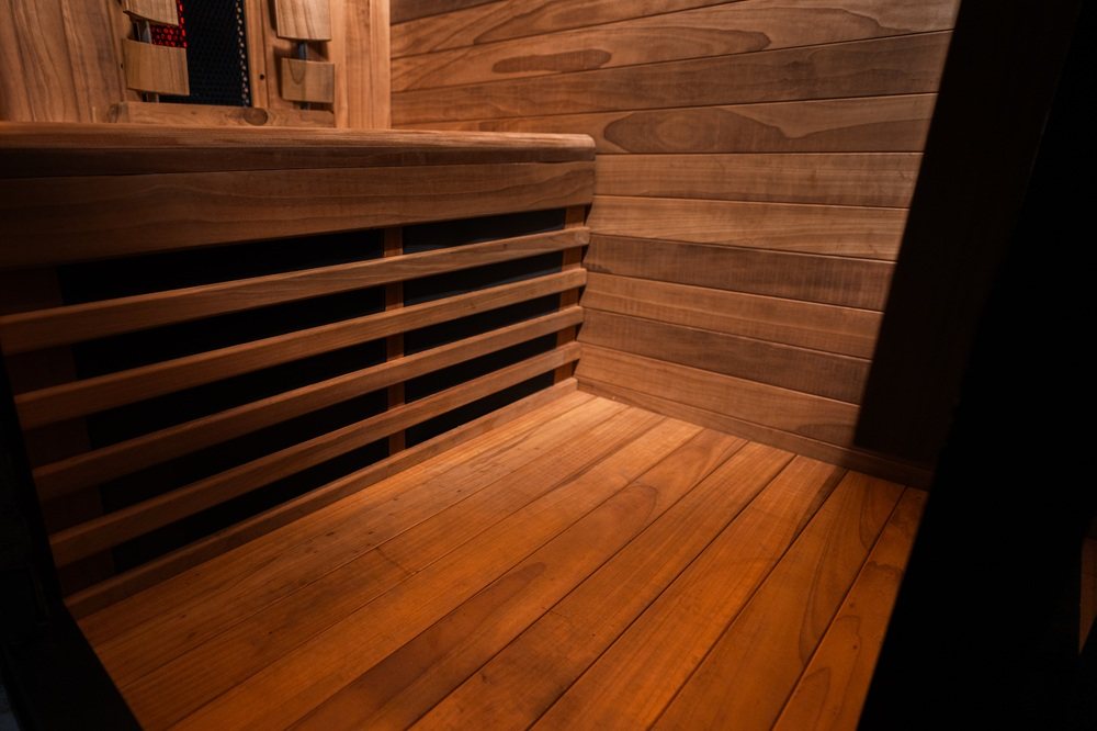 Interior bench and floor detail inside the Hekla IR100 infrared sauna.