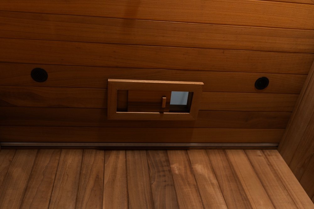 Interior vent and speaker detail inside the Hekla IR100 infrared sauna.
