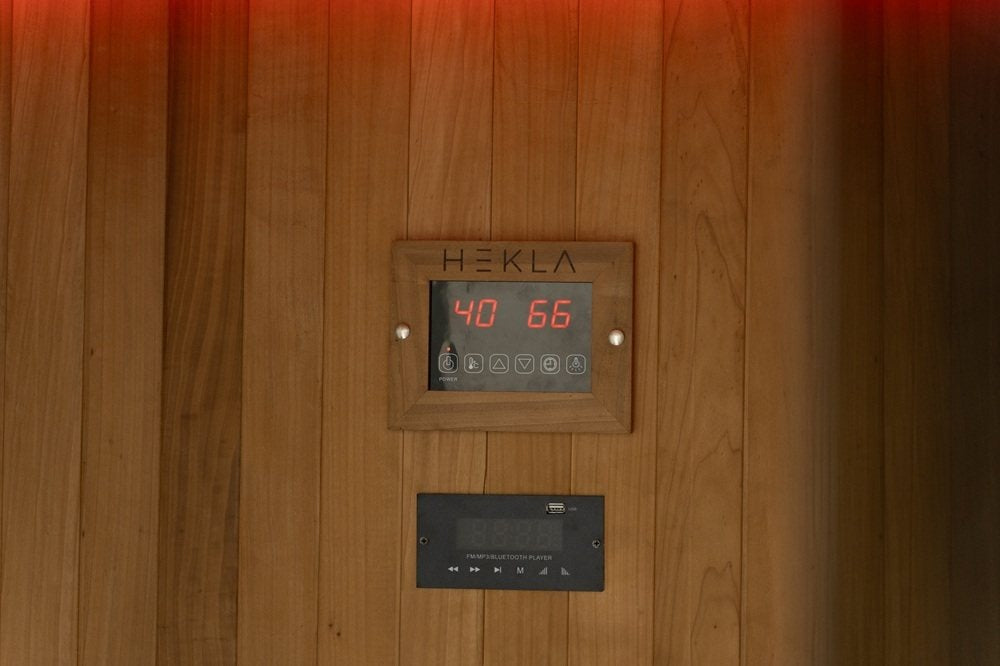 Hekla infrared sauna controls and audio panel inside the cabin.