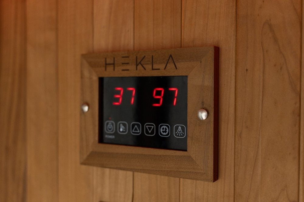 Hekla infrared sauna control panel with temperature display.