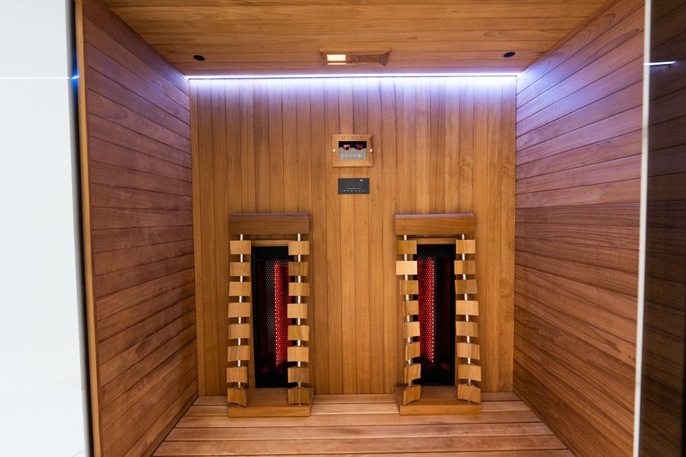 Interior wide view heaters view of the Hekla IR160 2 person infrared sauna cabin.
