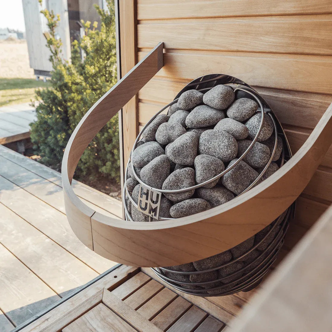 HUUM DROP electric sauna heater, installed in sauna.