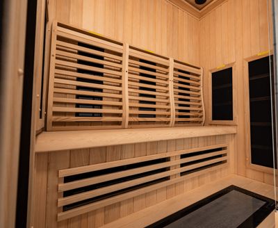 Interior bench and infrared heaters inside Within Wellness Select Studio sauna (SRA100-A).