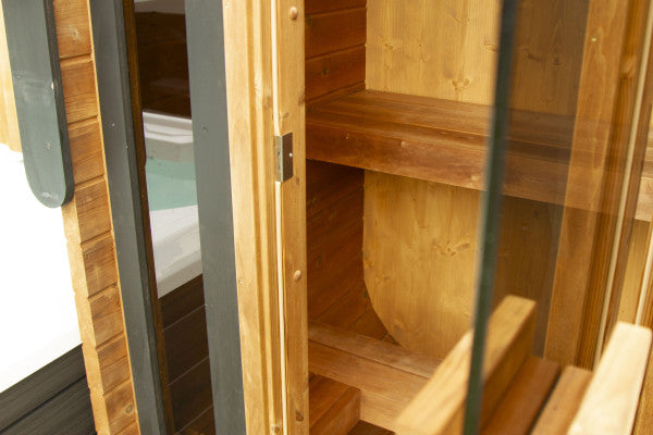 Woodchop Oval outdoor sauna 2 person, interior bench view.